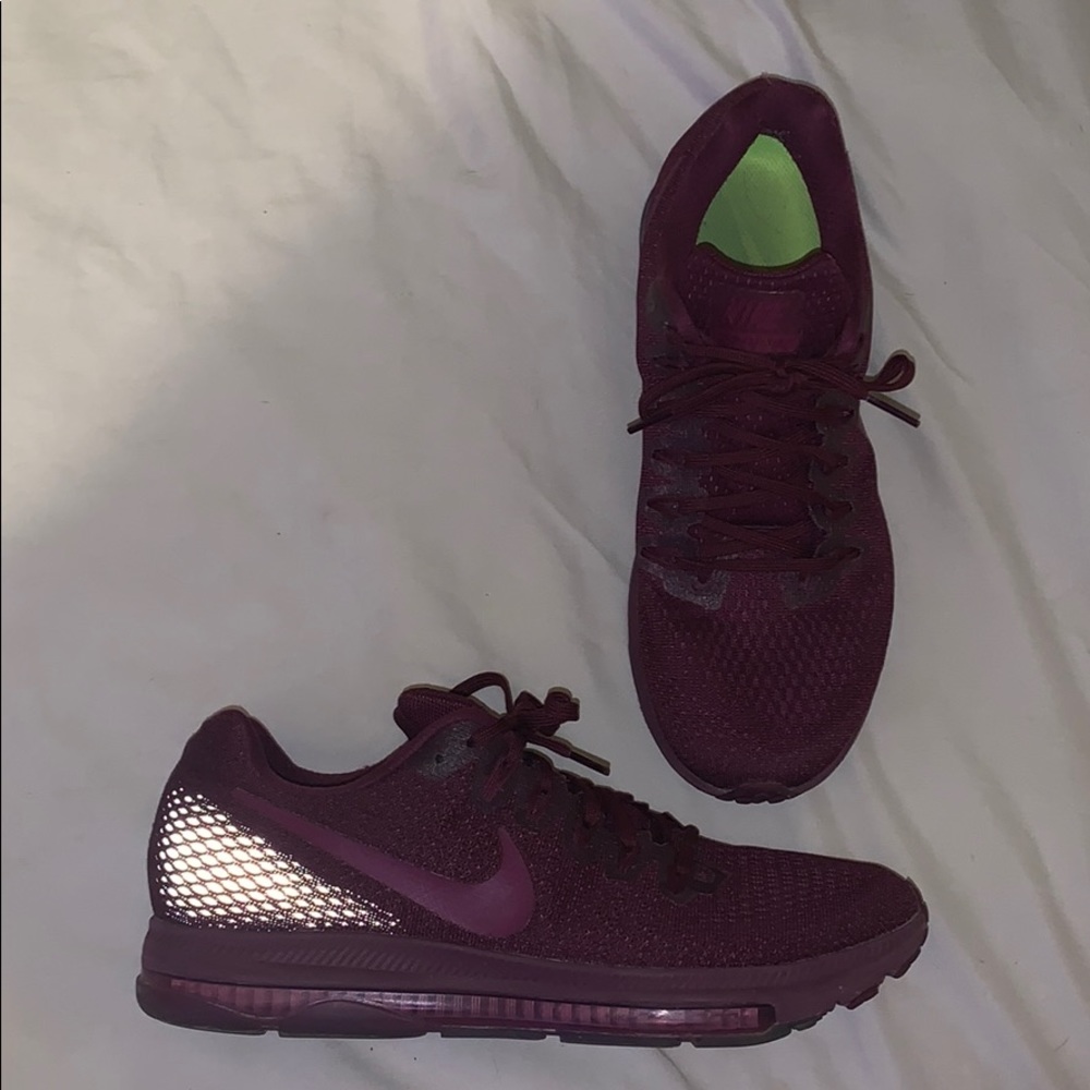 Burgundy reflective Nike running shoes